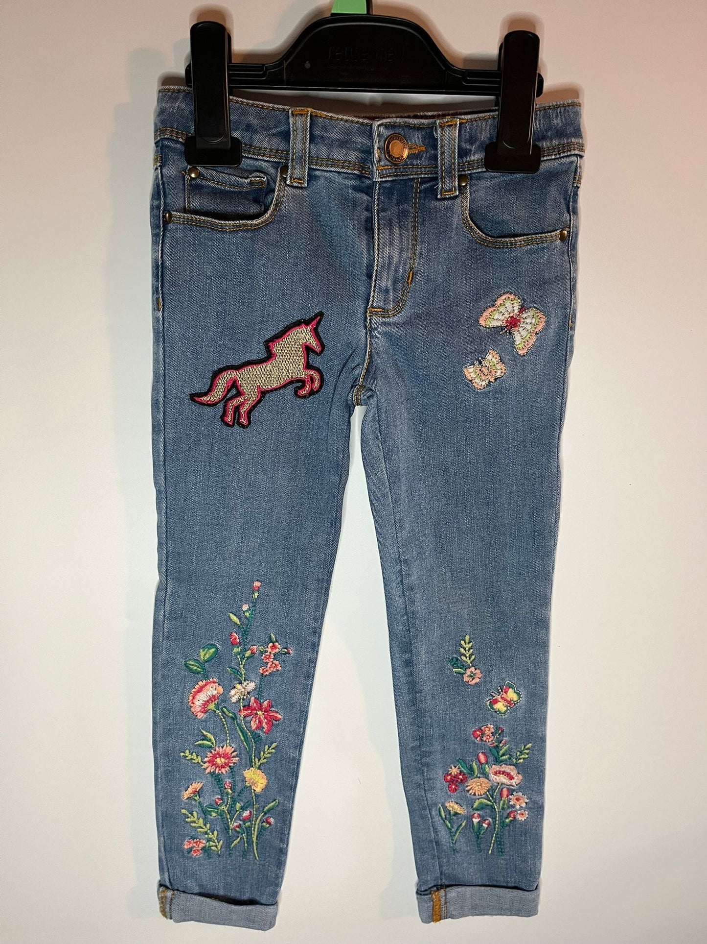 Embroidered jeans with floral designs and a unicorn patch. Monsoon - Little Drums preloved