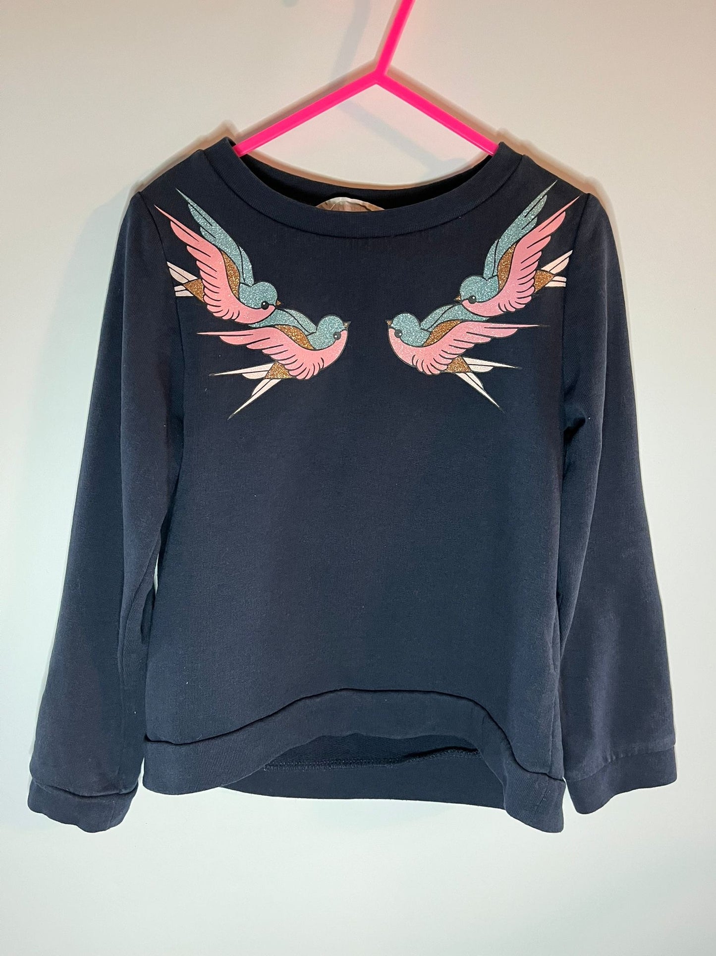 Navy blue sweatshirt with pink and green bird designs. H&M, preloved little drums
