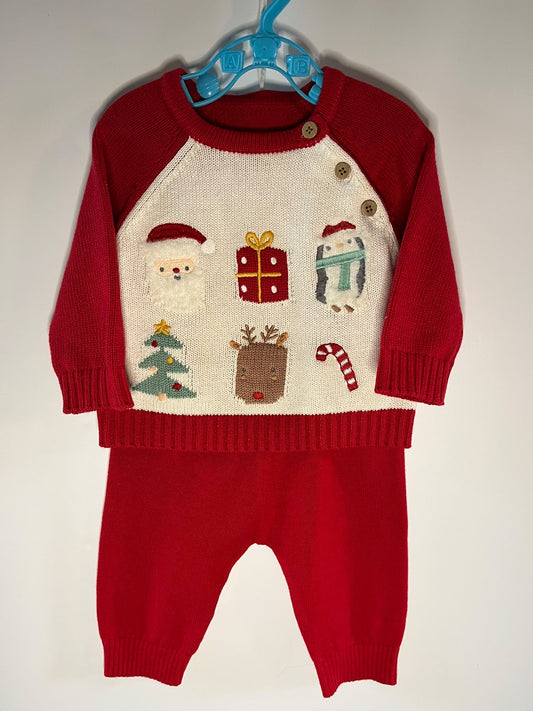 A baby holiday knit two-piece outfit consisting of a red and cream raglan sweater with Christmas-themed embroidered motifs and matching red pants, nutmeg little drums preloved 