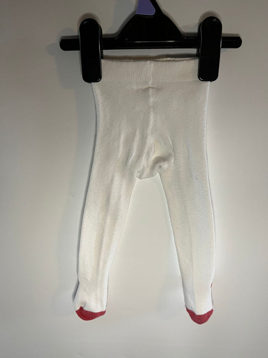 White tights with red toes on a black hanger against a white background