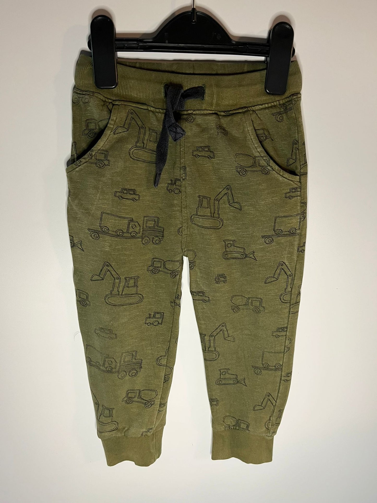 Green children's jogger pants with vehicle pattern next preloved little drums 
