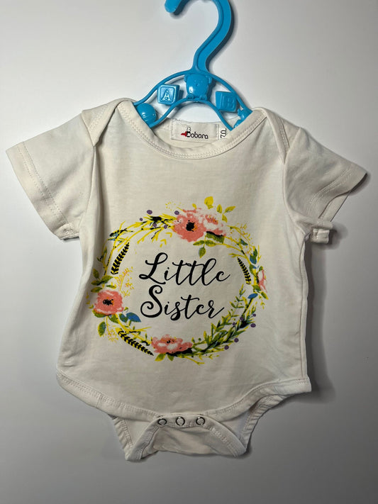 Baby vest with 'Little Sister' text and floral design, preloved little drums