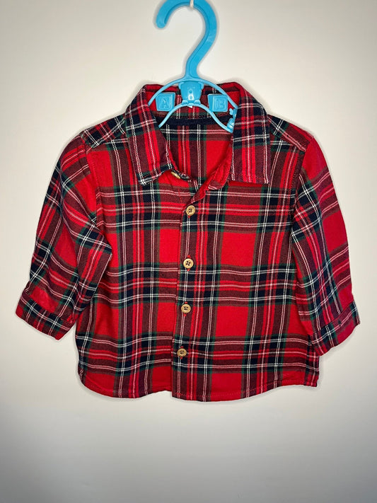 Red plaid shirt on a blue hanger against a white background little drums preloved 