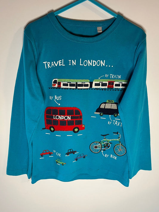 Blue long-sleeve shirt with London-themed graphics on a white background