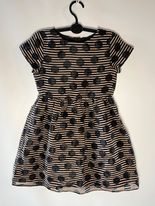 A short-sleeve children's dress with a black and brown horizontal stripe pattern and large black polka dots, little drums preloved next