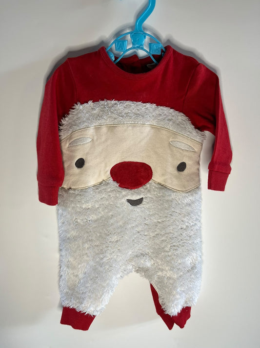 long-sleeve footless jumpsuit with a festive Santa Claus face applique, featuring a red top and legs, a beige face patch, and a fluffy white faux-fur body, John Lewis newborn preloved 