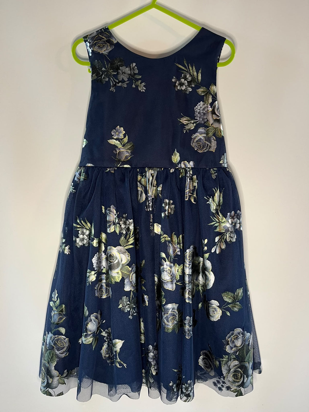 A sleeveless navy blue dress with a white and gray floral print, monsoon preloved little drums 