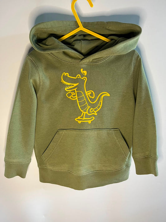 An olive green kids' pullover hoodie with a yellow cartoon alligator graphic on the chest, gap size 3 years. Little drums, preloved clothing 
