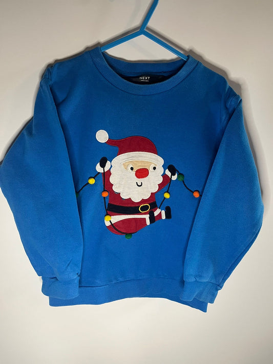 Blue sweater with Santa Claus next, size 3 to 4 years. Preloved, little drums