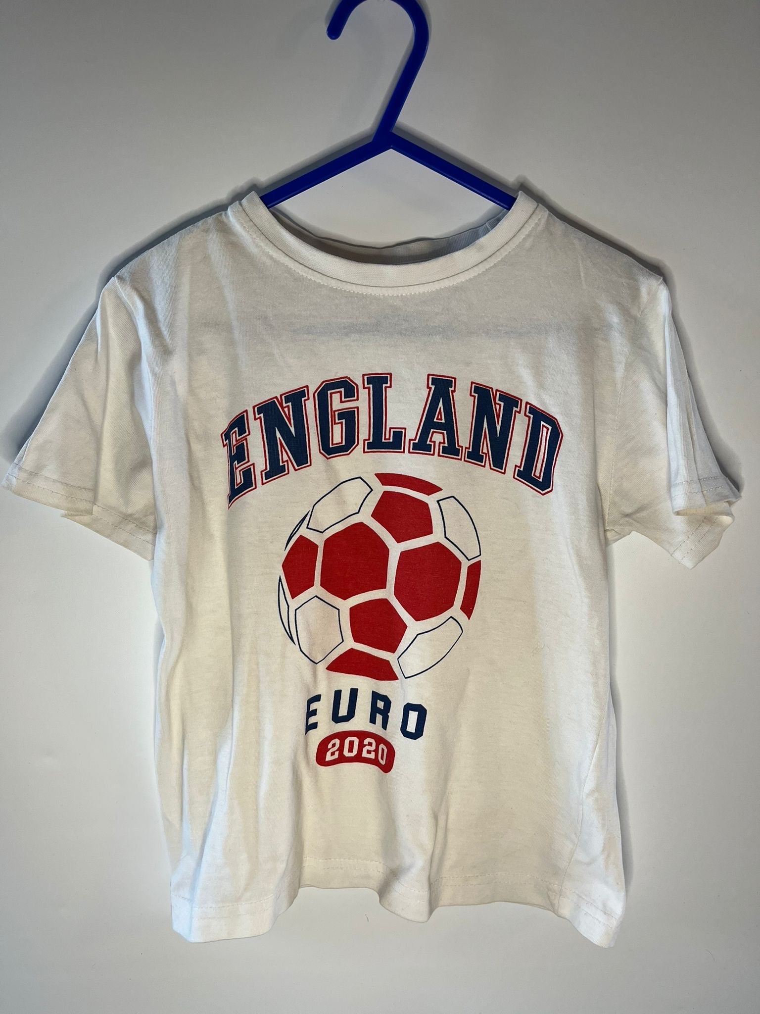 White t-shirt with 'England Euro 2020' design on a hanger against a white background