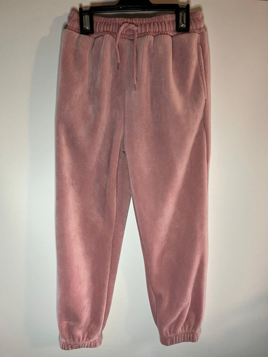 Pink corduroy pants on a hanger against a white background, little drums, preloved. Nutmeg, size 7 to 8