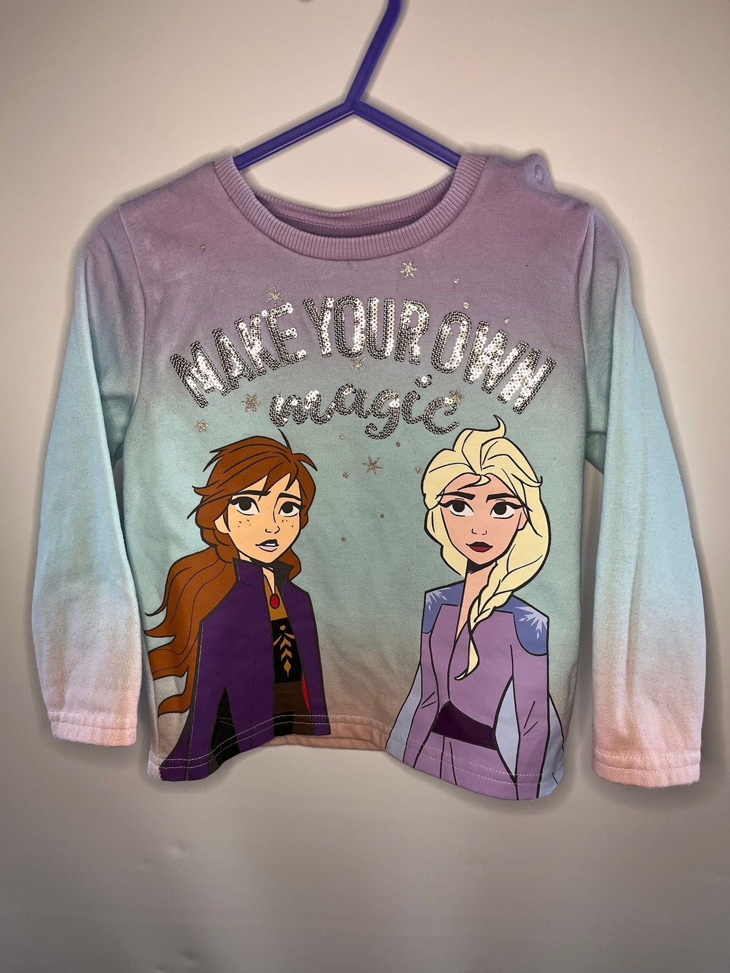 Long-sleeve shirt with two animated characters and 'Make your own magic' frozen preloved little drums 