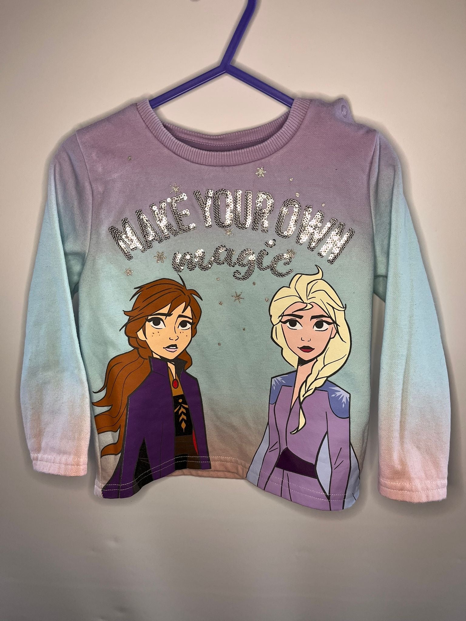 Long-sleeve shirt with two animated characters and 'Make your own magic' frozen preloved little drums 