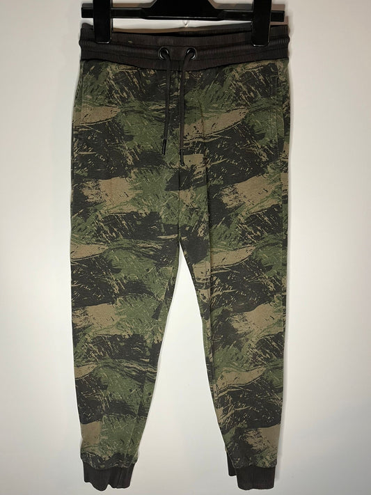 Camouflage pants on a hanger against a white background. F&F jogger bottoms, preloved little drums 